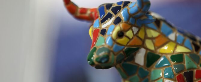 A colorful mosaic bull figurine, representing a bullish market